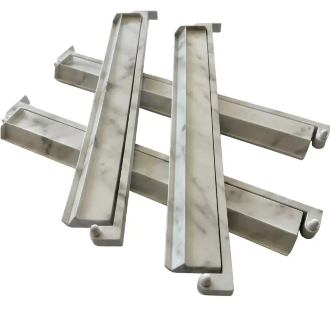 Four white marbled Mahjong racks with gray veining and silver-colored edges